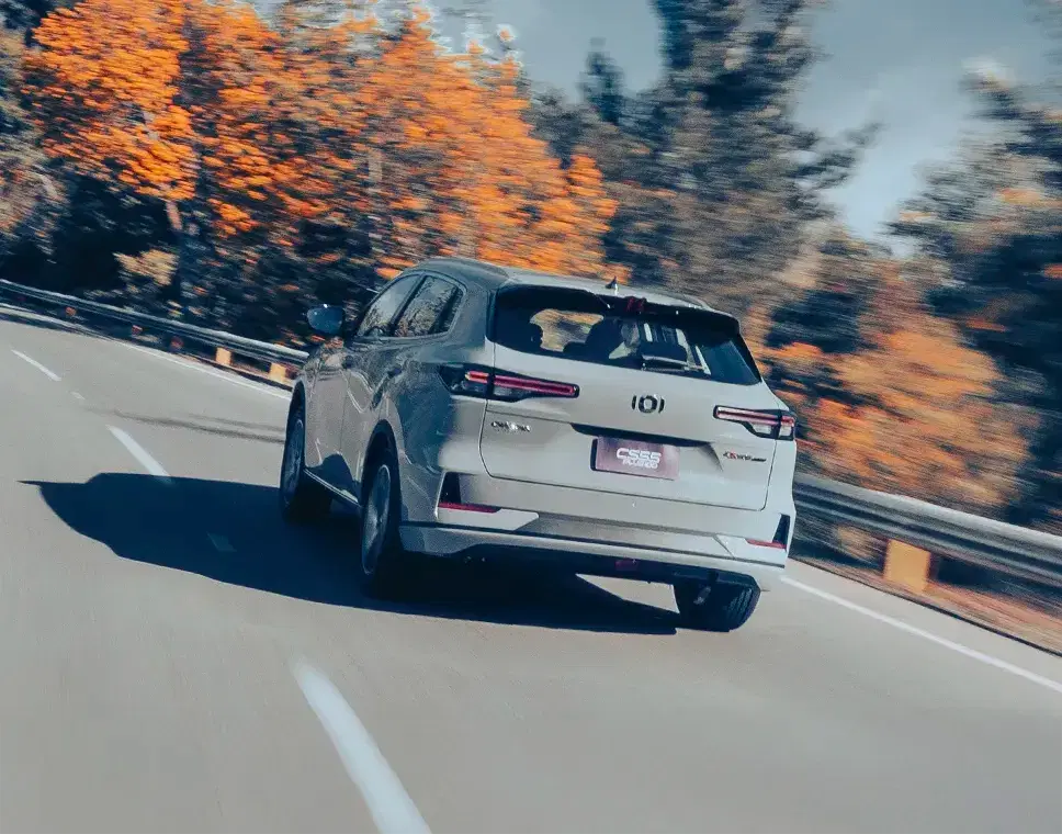 Car on a steep hill, with graphics showing the hill-hold assist preventing it from rolling back.